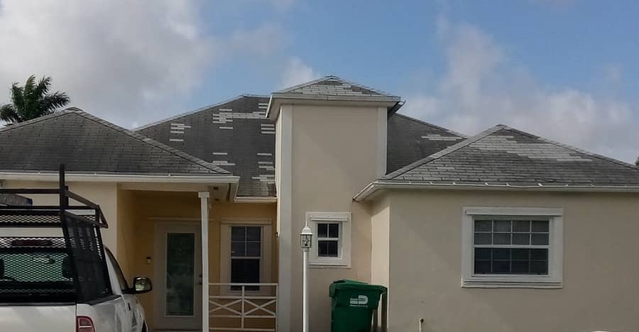 Worn shingle roof with patched sections
